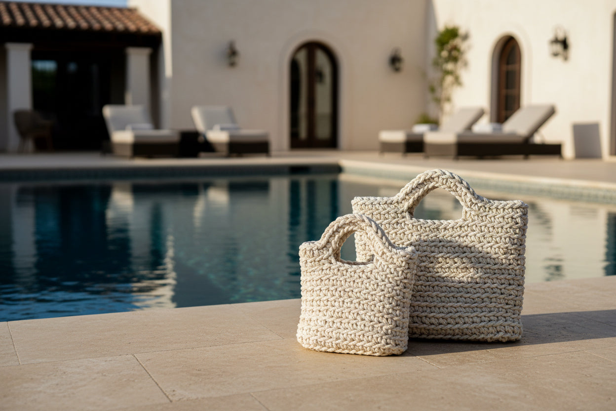 Two woven handbags poolside.