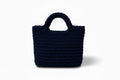 Dark navy woven handbag on a white background