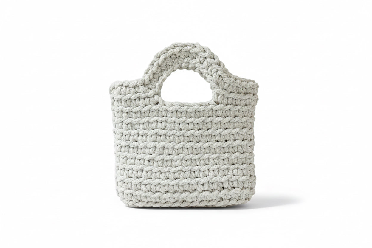 Woven handbag on a white background.